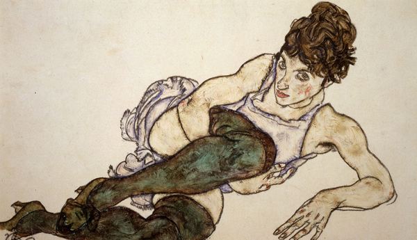 Reclining Woman with Green Stockings. The painting by Egon Schiele