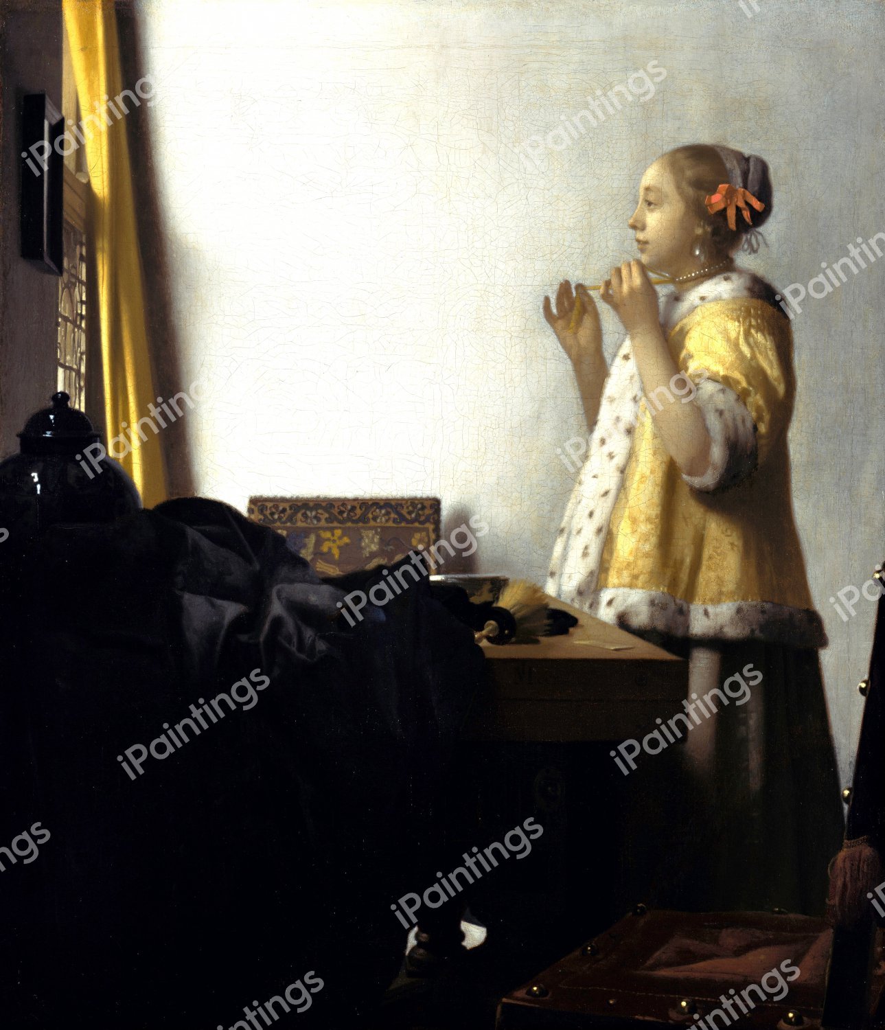Young Woman with a Pearl Necklace. The painting by Jan Vermeer