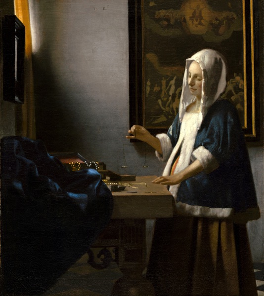Woman Holding a Balance. The painting by Jan Vermeer