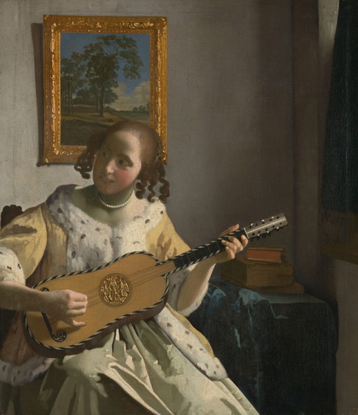 Young Woman Playing a Guitar. The painting by Jan Vermeer