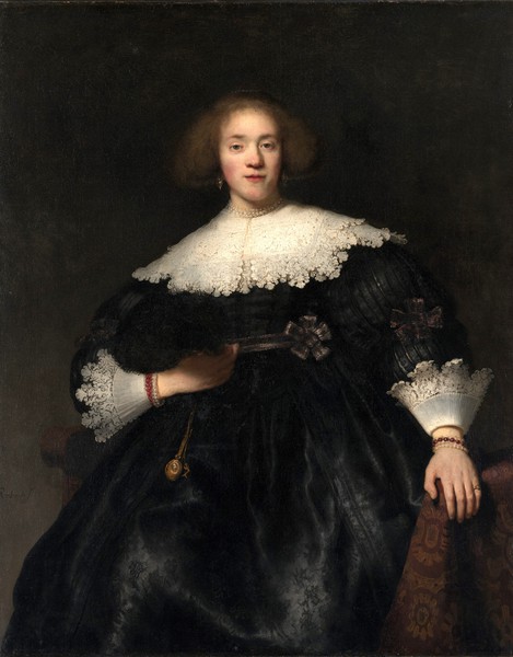 Portrait of a Young Woman with a Fan. The painting by Rembrandt van Rijn